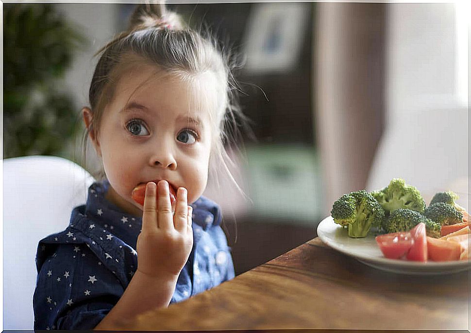 Little girl eating.