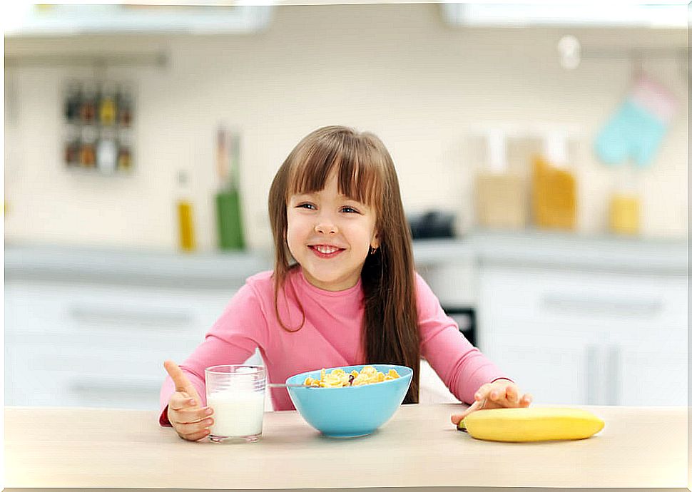 Little girl having breakfast.