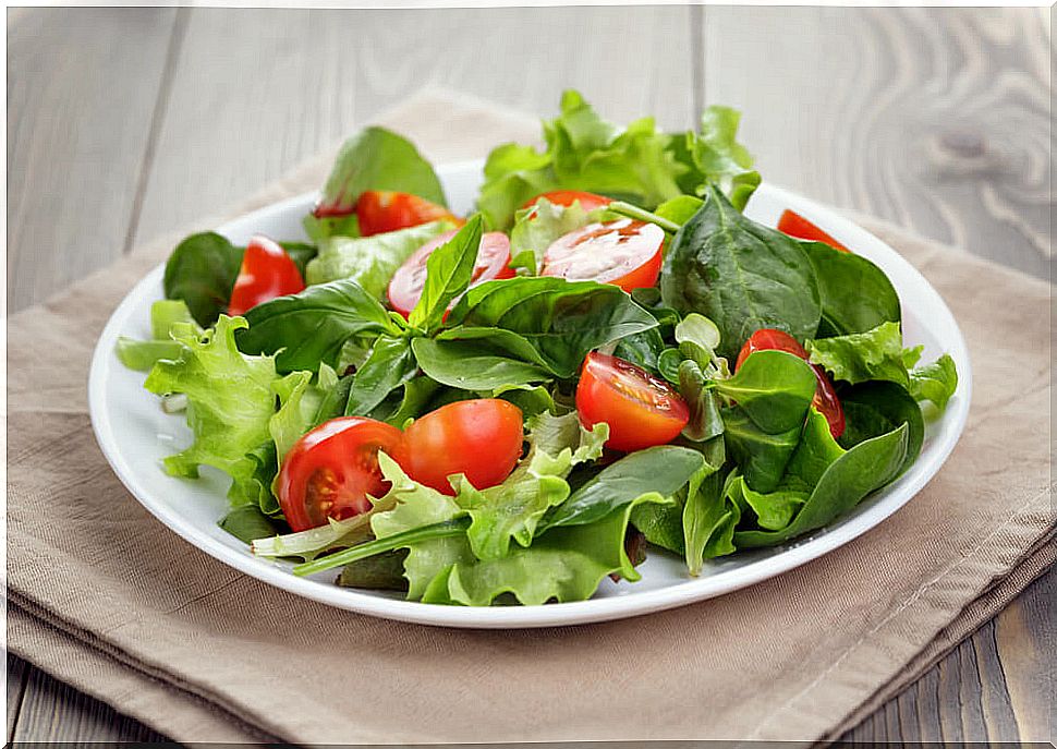 Salad on a small plate.