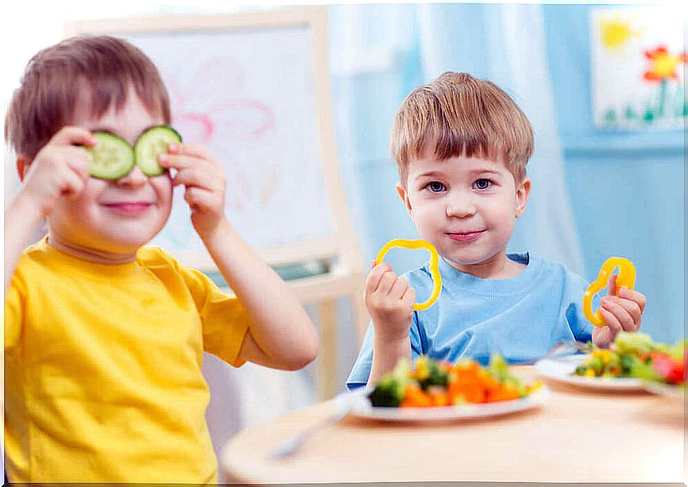 Children playing with vegetables.