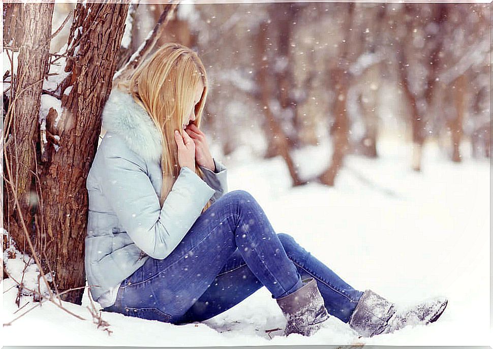 Woman in snow with symptoms of hypothermia