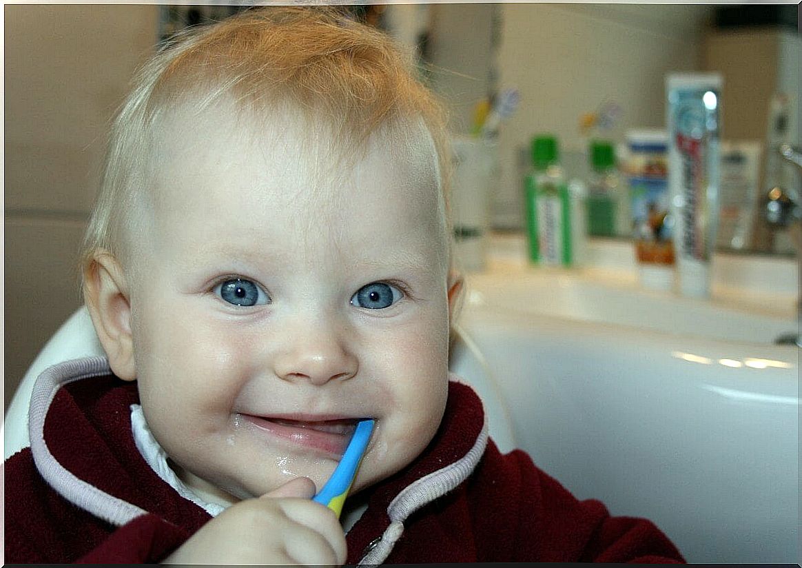 Child brushing his teeth.