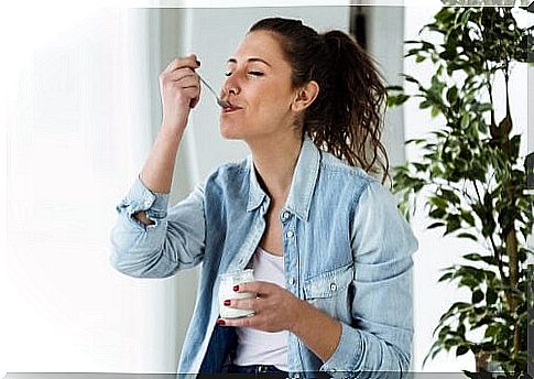 Woman eating yogurt