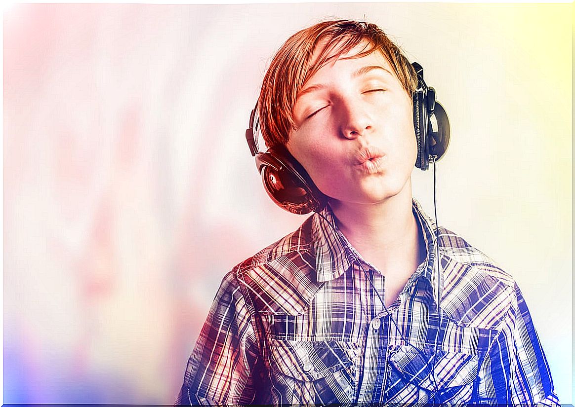 Young man whistles listening to music.