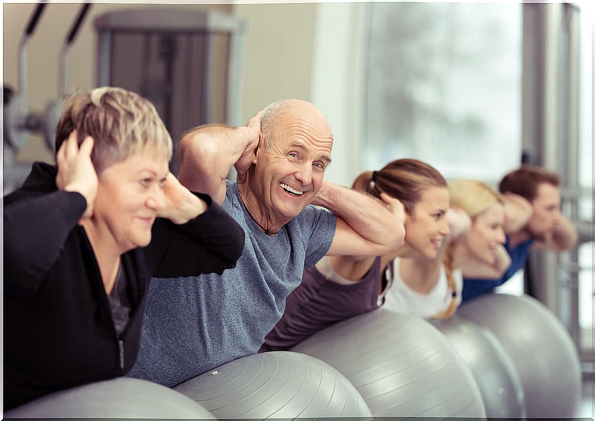 Elderly people exercise in a care institution.